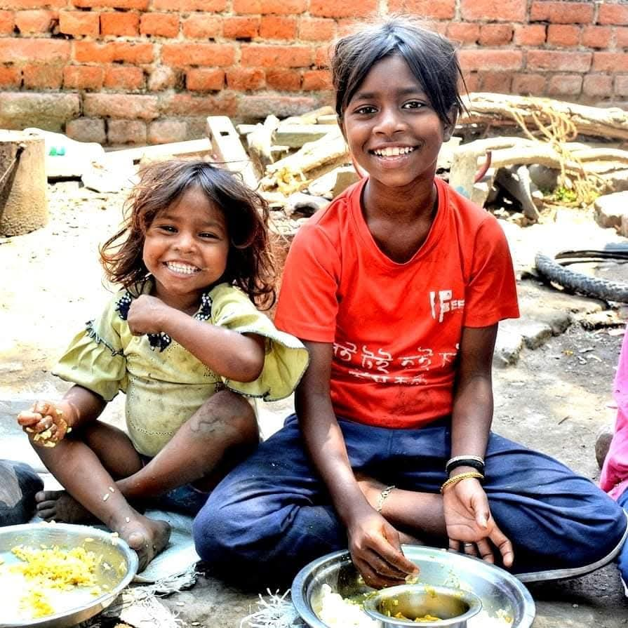 Smiling children at FEED center